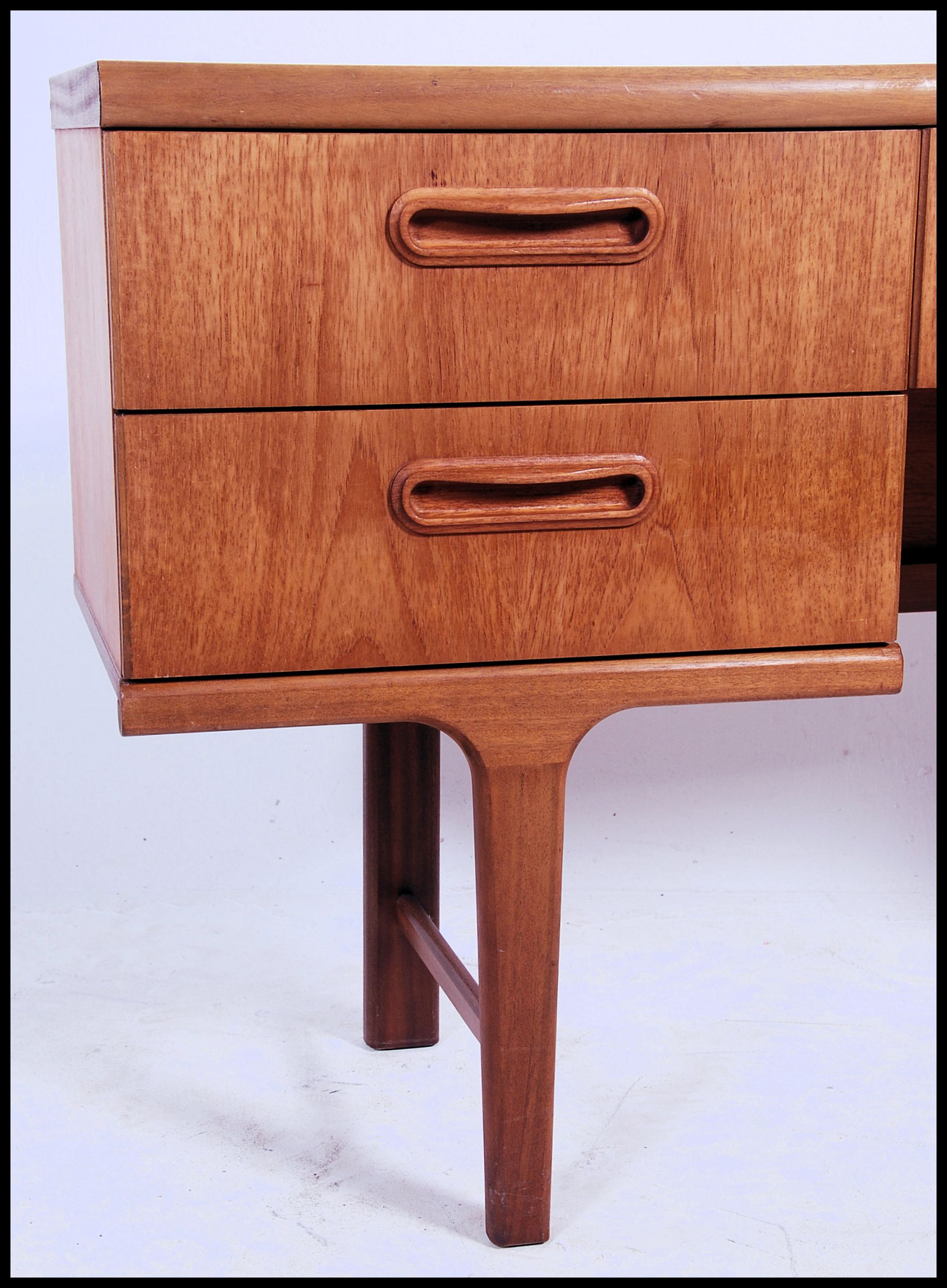 A 1970's Danish inspired retro teak wood writing table desk. The desk with central kneehole recess - Image 5 of 5