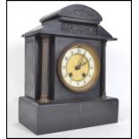 Am Edwardian Slate and Marble mantle clock having gilded columns  with 8 day movement, gilt enamel