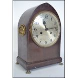 An Edwardian mahogany lancet shaped mantel clock w
