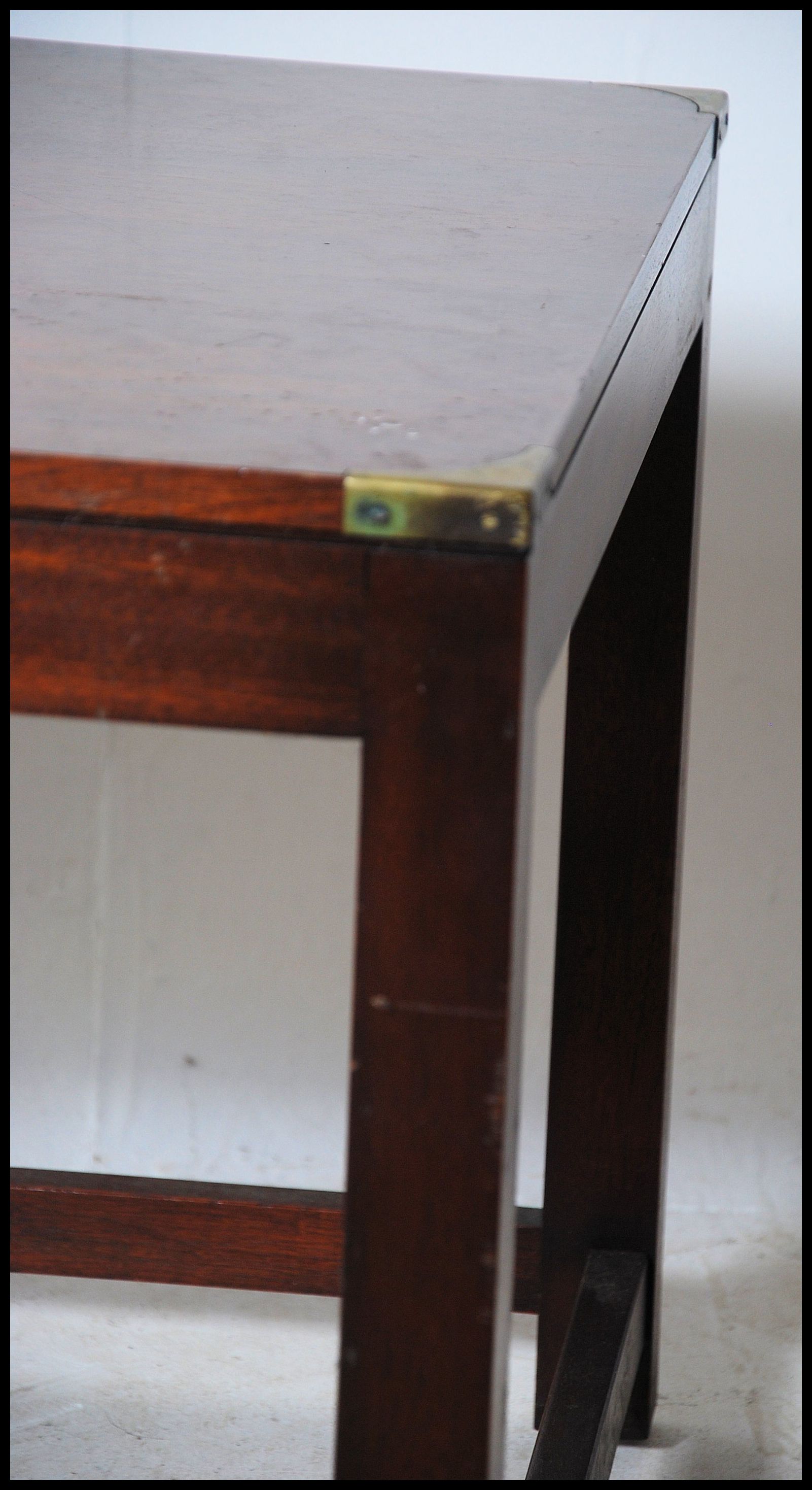 A mahogany and brass bound campaign style square coffee - occasional table being raised on sqaured - Image 3 of 4