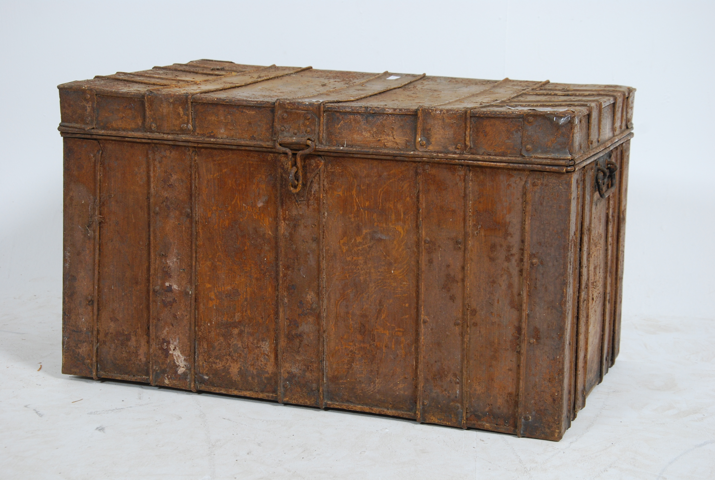 A late 19th century tin steamer trunk chest of square form. Banded effect finish with hinged lid and