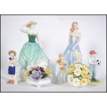 A good group of Royal Doulton figurines to include Taylor HN4496 Emily HN4093 Pride and Joy HN4102