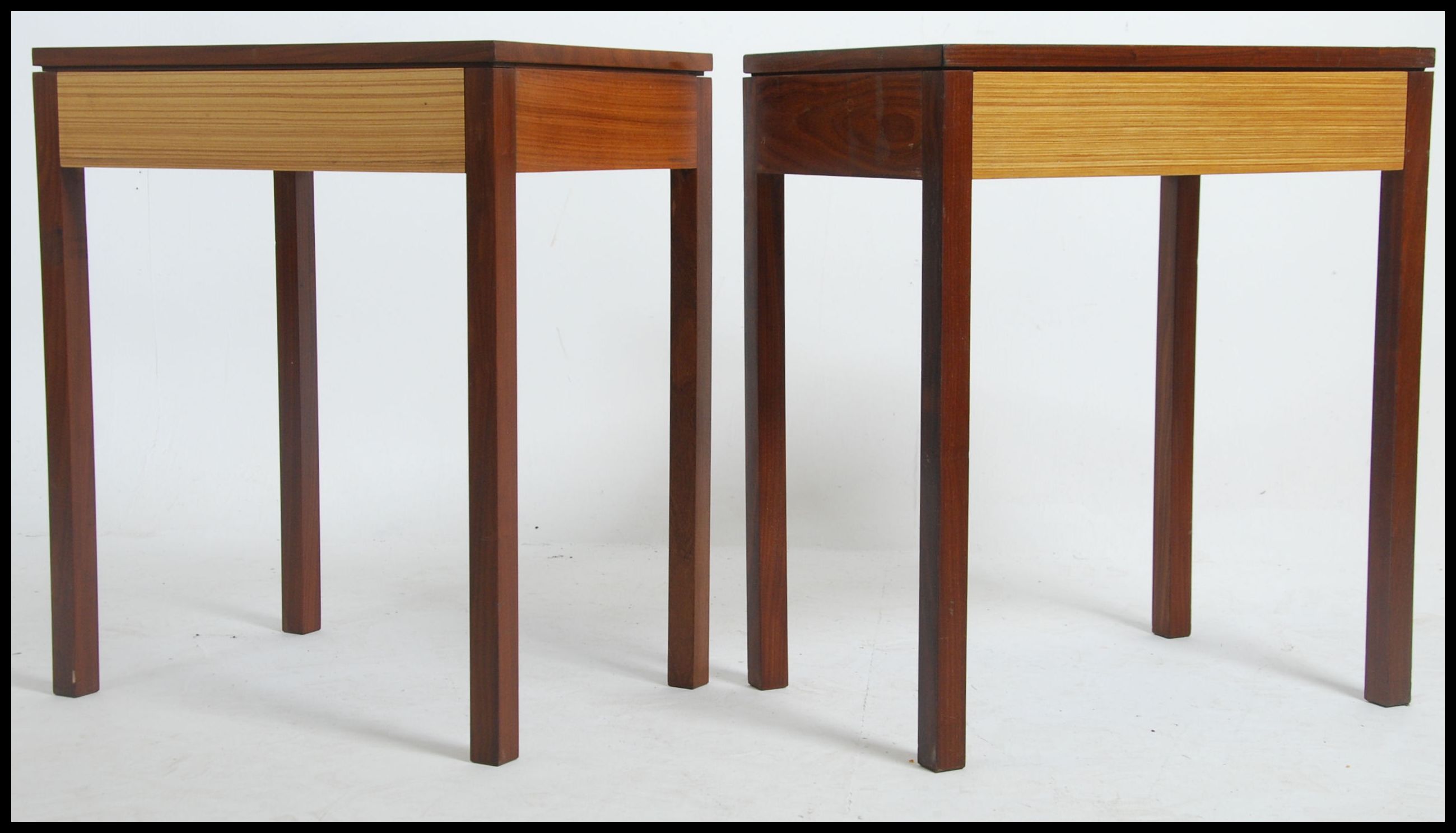 A pair of 1970's teak wood two tone retro Air Ministry side table - bedside tables. Each raised on