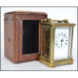 A good early 20th century brass carriage clock complete with leather carry case and key. The