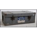 A substantial vintage early 20th century metal steamer trunk. Large carry handles to the side with