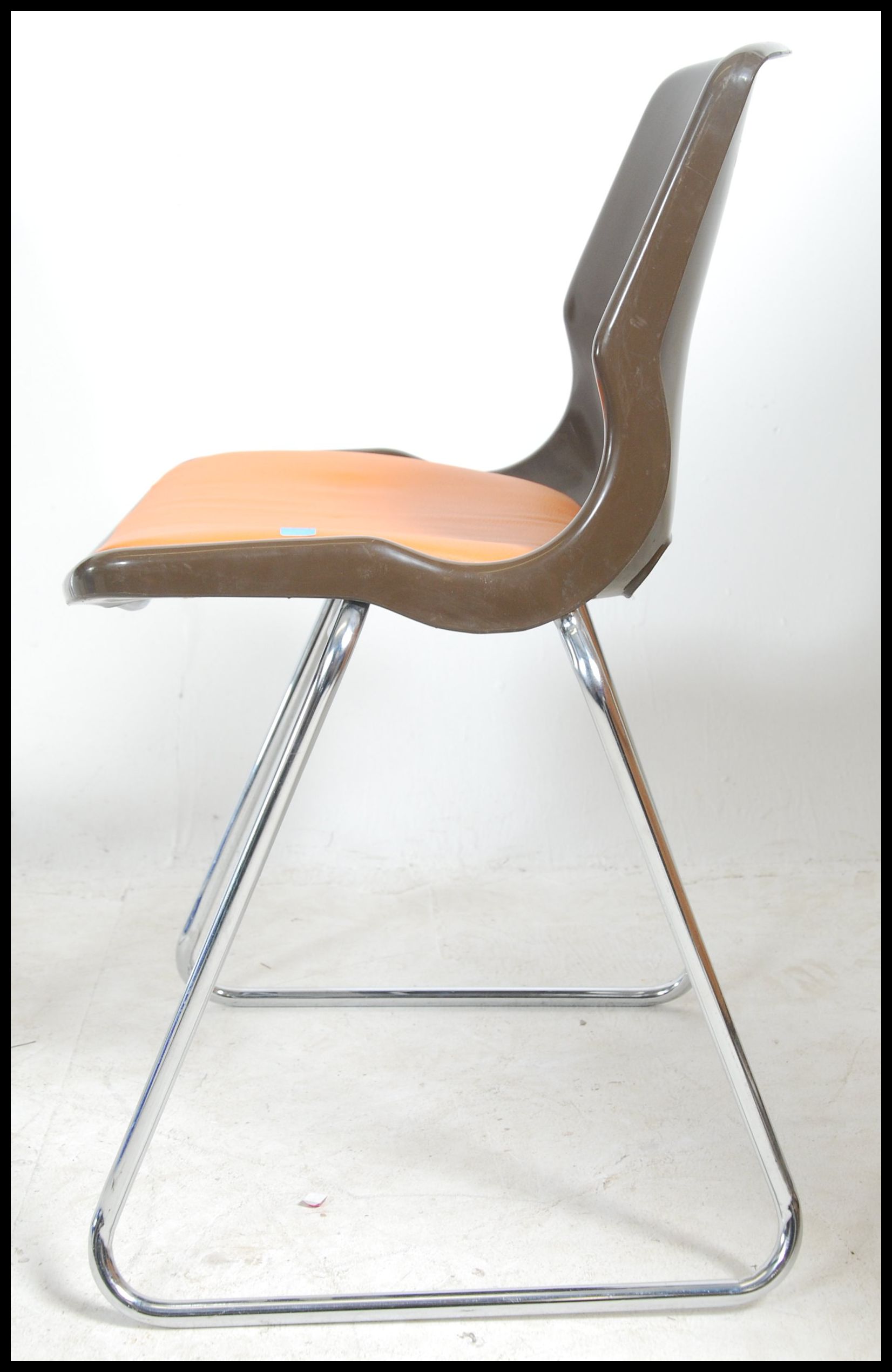 A set of 1970's retro stacking chairs in brown plastic having orange pad seats to the centre being - Image 4 of 4