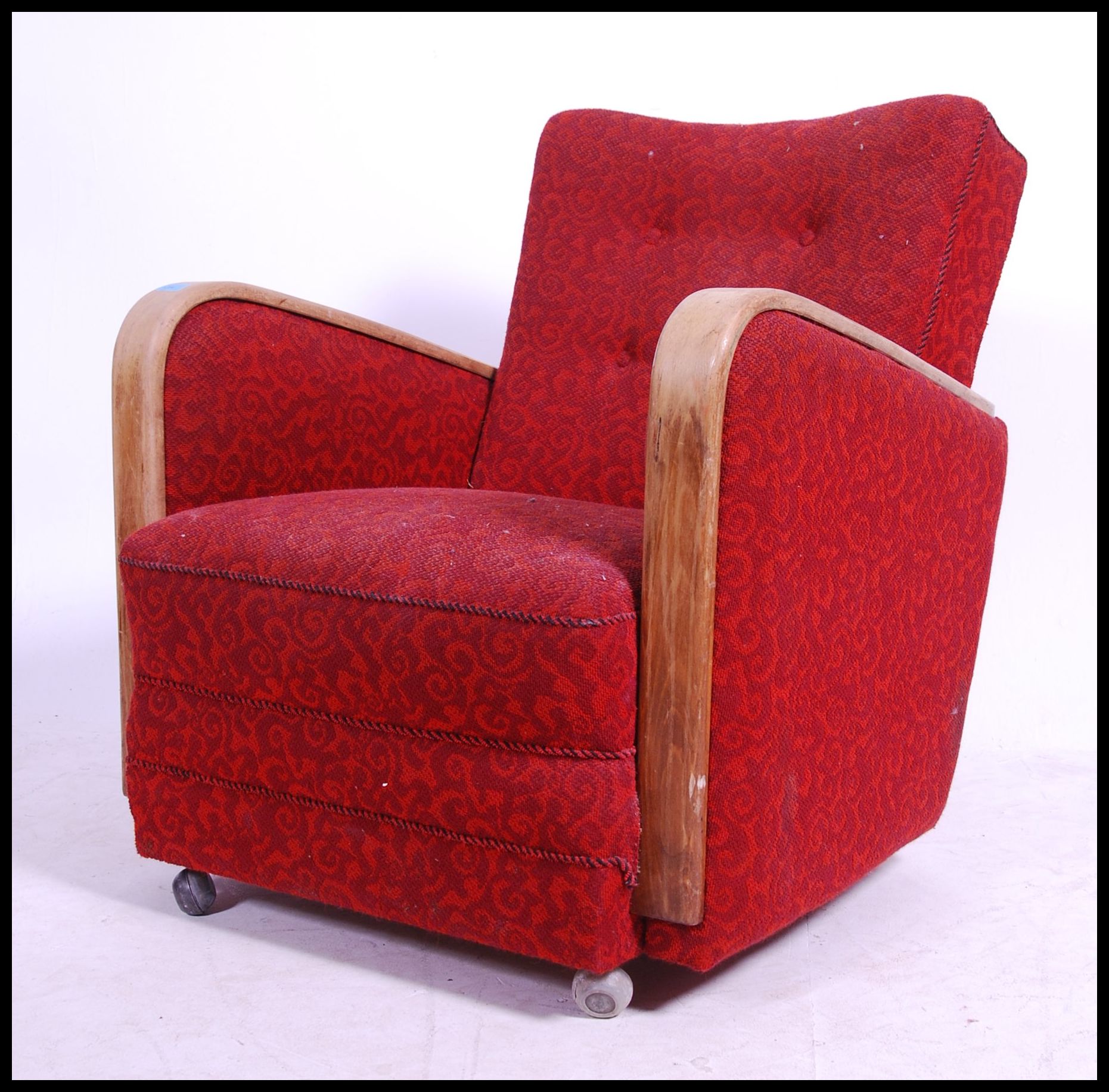 A good 1930's Art Deco club armchair having red moquette upholstered frame with bentwood oak