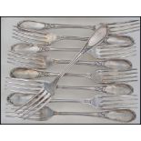 A set of 9 19th century French heavy large white metal table forks. Each marked for Ercuis OE84.