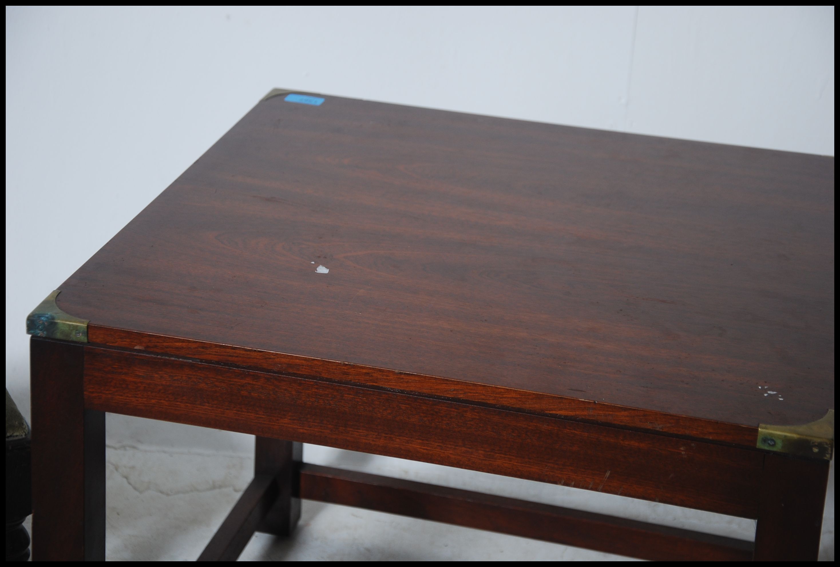 A mahogany and brass bound campaign style square coffee - occasional table being raised on sqaured - Image 4 of 4