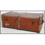 An early 20th century canvas  cane banded steamer trunk locks  and clasps to the front