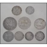 A small collection of silver coins dating from the