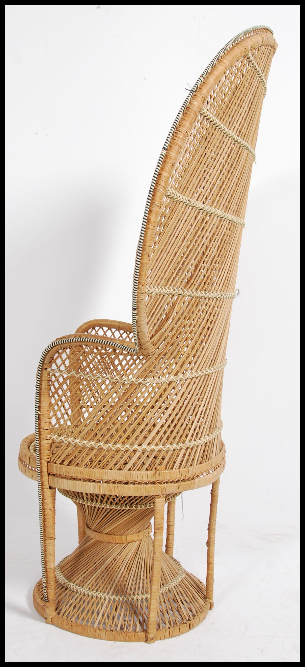 A vintage 20th century retro wicker peacock armchair with a large open back and woven seat. Measures - Image 4 of 5