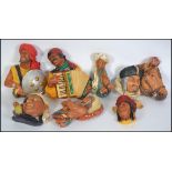 A collection of eight vintage mid century wall hanging plaques by Bossons. To include Native