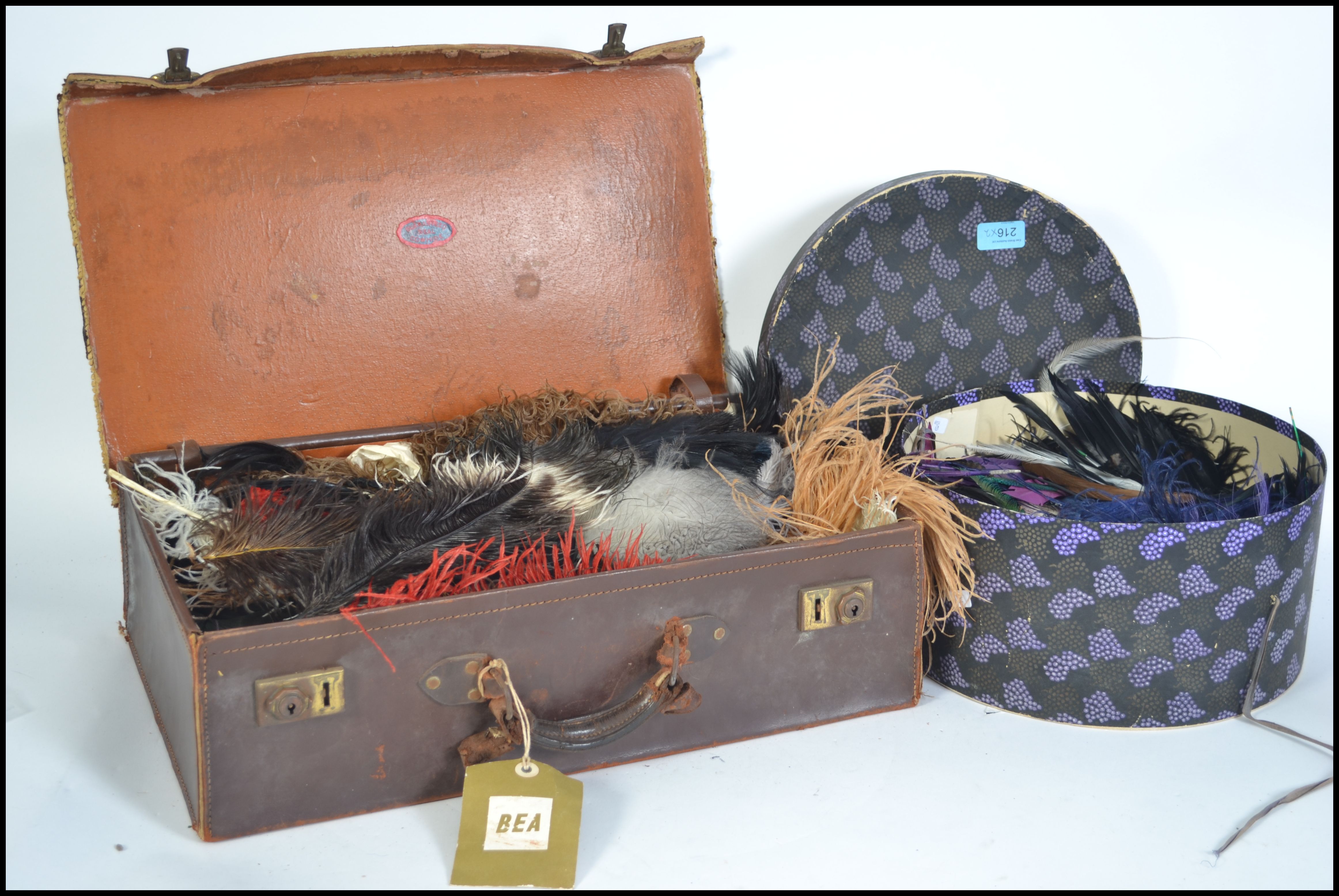 A large quantity of 20th century Milliners hat / fascinator feathers contained within a leather