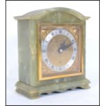 A mid century green marble mantel clock by Mappin & Webb dual marked also for Elliott of London.