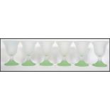A set of six early to mid 20th century frosted glass fluted sundae dishes raised on pastel green