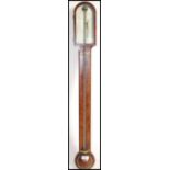 A 19th century Georgian mahogany stick barometer. The silvered barometer dial marked for Singers