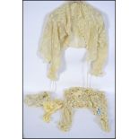 A collection of early 20th century ladies clothes.  Lacework / crochet pieces to include ivory