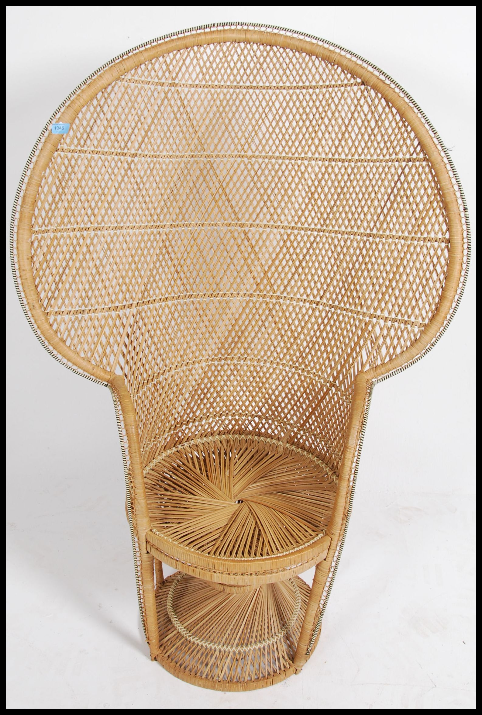 A vintage 20th century retro wicker peacock armchair with a large open back and woven seat. Measures - Image 3 of 5