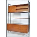 A 1970's retro teak wood and modular metal upright