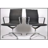 A pair of retro style Eames chrome and faux black