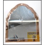 A 1930's peach glass Venetian wall mirror of arche