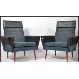 A pair of mid century retro two tone armchairs hav