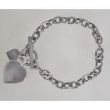 A silver heavy chain linked bracelet wit