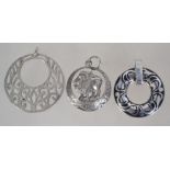 A collection of 3 silver necklace pendan