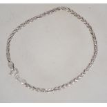 A silver rope linked bracelet / bangle w