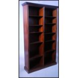 A large Regency revival mahogany double bookcase o