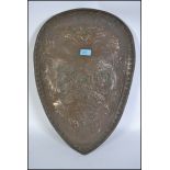 A decorative wall hanging  plaster shield decorate