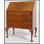 A vintage mid 20th century walnut bureau. having f