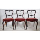 A set of 3 Victorian rosewood balloon back dining