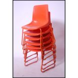 A set of six retro Robin Day style stacking chairs