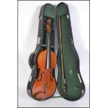 Musical Instruments. A 20th century cased violin b