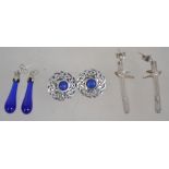 Three pairs of silver 925 earrings to include a Celtic knot shield pair with central blue stone, a