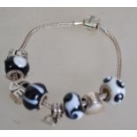 A Miss Rhoana Sutton silver 925 charm fox tail bracelet with black and white ball charms, silver