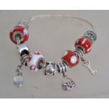 A Miss Rhoana Sutton silver 925 charm fox tail bracelet with red and white ball charms, silver heart