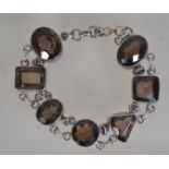 A fantastic silver 925 bracelet chain having a dual rolo link chain with large faceted citrine