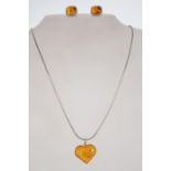 A silver 925 snake link necklace chain with spring hoop clasp having a heart shaped amber type