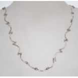 A silver 925 rib bone and ball link necklace chain having a spring hoop clasp. Chain measures 18