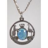 A silver fob pendant bearing the Australian coat of arms having a central opal triplet stone