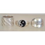 A group of three silver 925 rings to include a silver signet ring, a band ring with diagonal paste