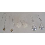 Three pairs of silver 925 earrings to include a silver wire ball pair, a wave design pair with