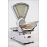 A set of vintage Avery white enamelled, triangular shaped shop counter scales with stainless steel