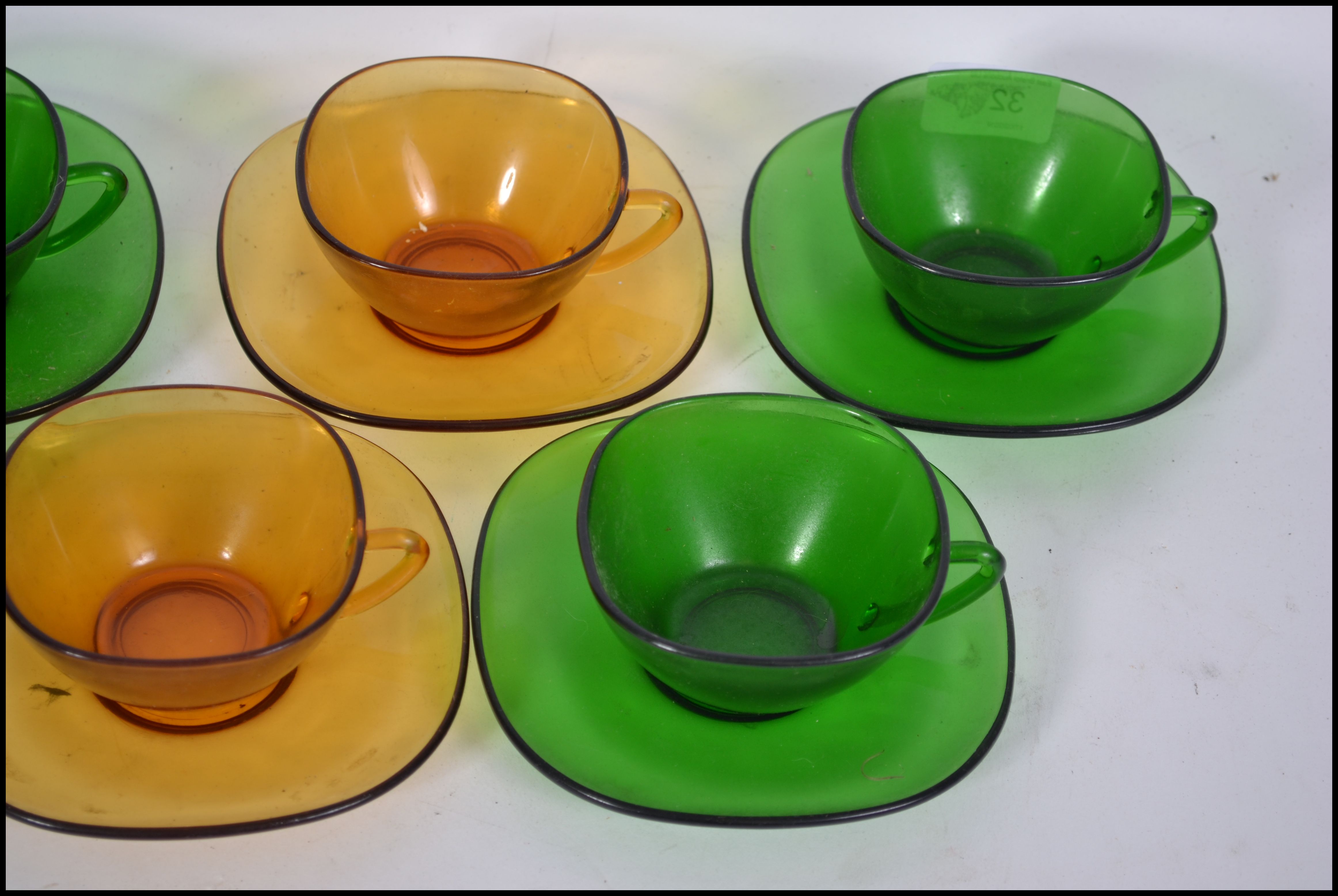 A group of eight French pressed coloured glass coffee cups and matching saucers - Image 3 of 5