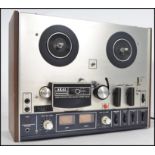 An original vintage Akai 4000DS model reel to reel tape recorder player set within original wooden
