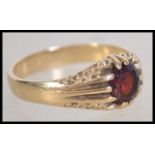 A 9ct gold and ruby garnet stone ring being hallma