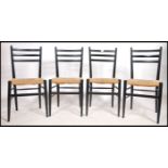 A set of 4 mid century ebonised and rattan weave retro dining chairs in the manner of Gio Ponti. The